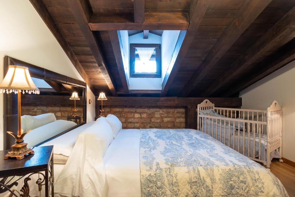 Postel nebo postele na pokoji v ubytování Casa Rural Adolfo