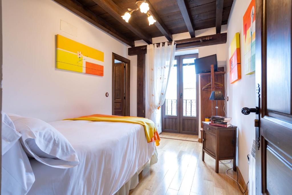 Postel nebo postele na pokoji v ubytování Casa Rural Adolfo