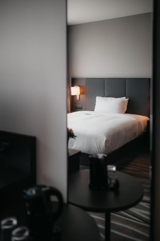 Postel nebo postele na pokoji v ubytování IIP Apartments - Self Check-In