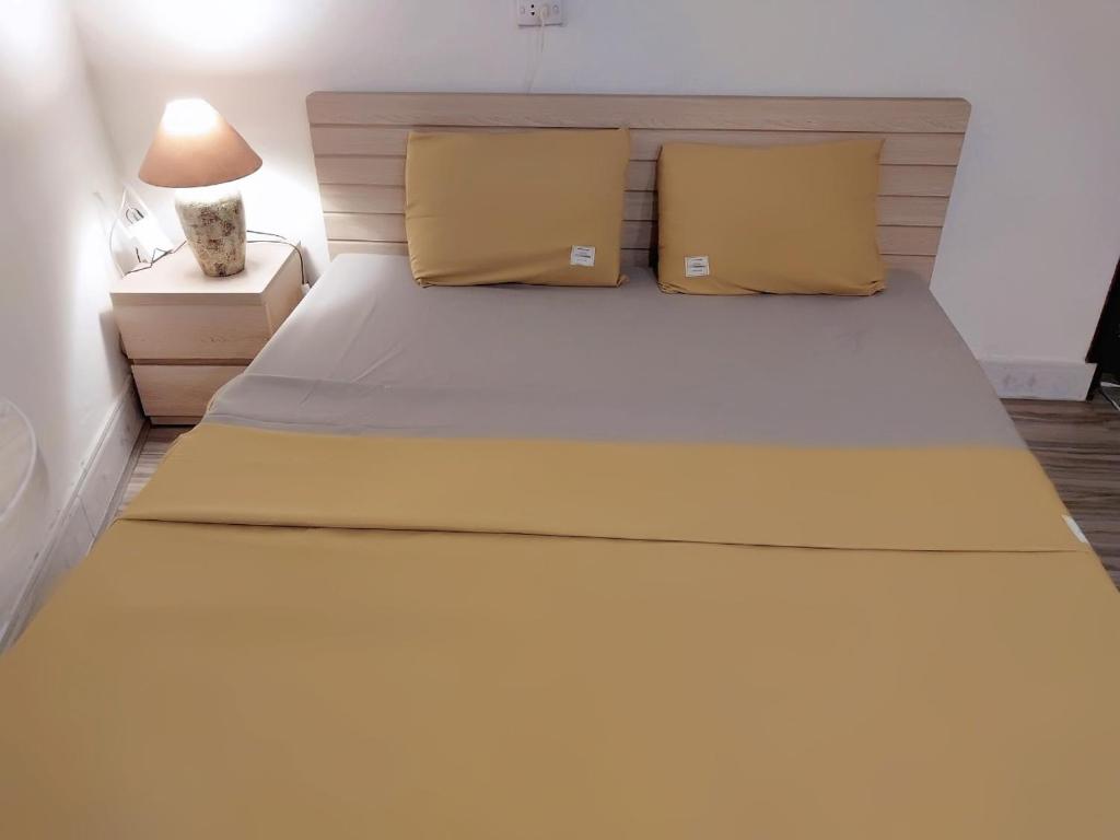 Postel nebo postele na pokoji v ubytování Da Tree Homestay