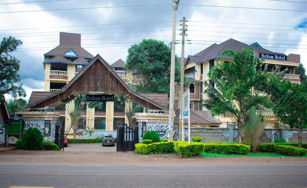 a large house with a gambrel roof at Bekam Hotel in Keruguya