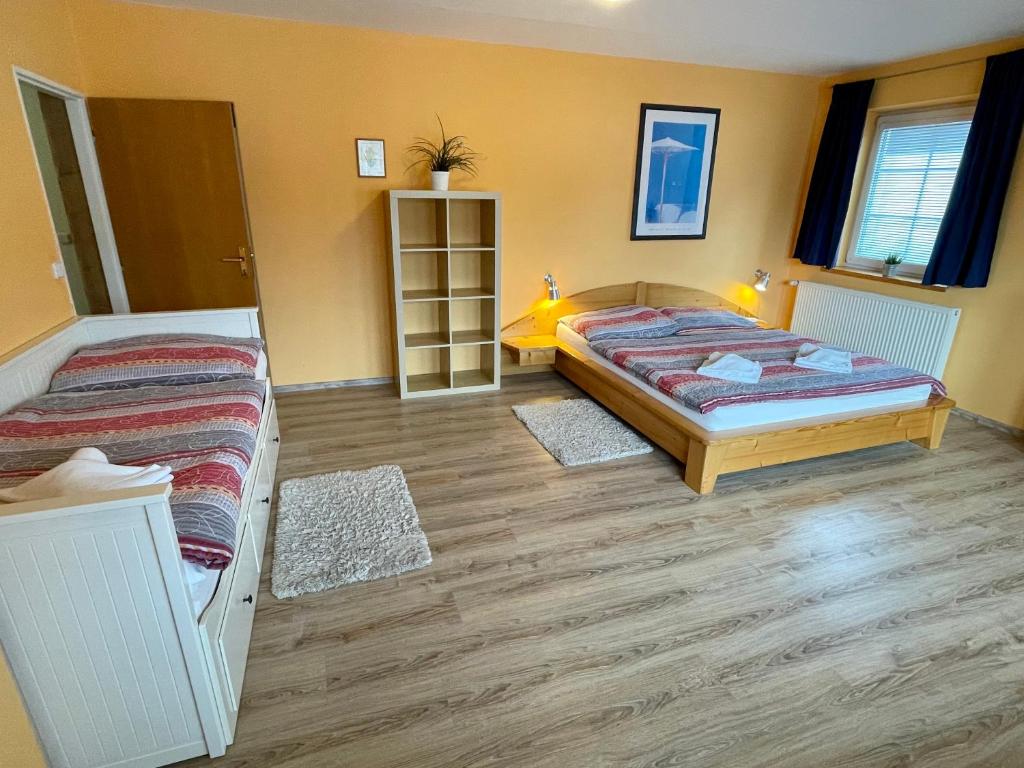 Postel nebo postele na pokoji v ubytování King size apartmán Pension Monika