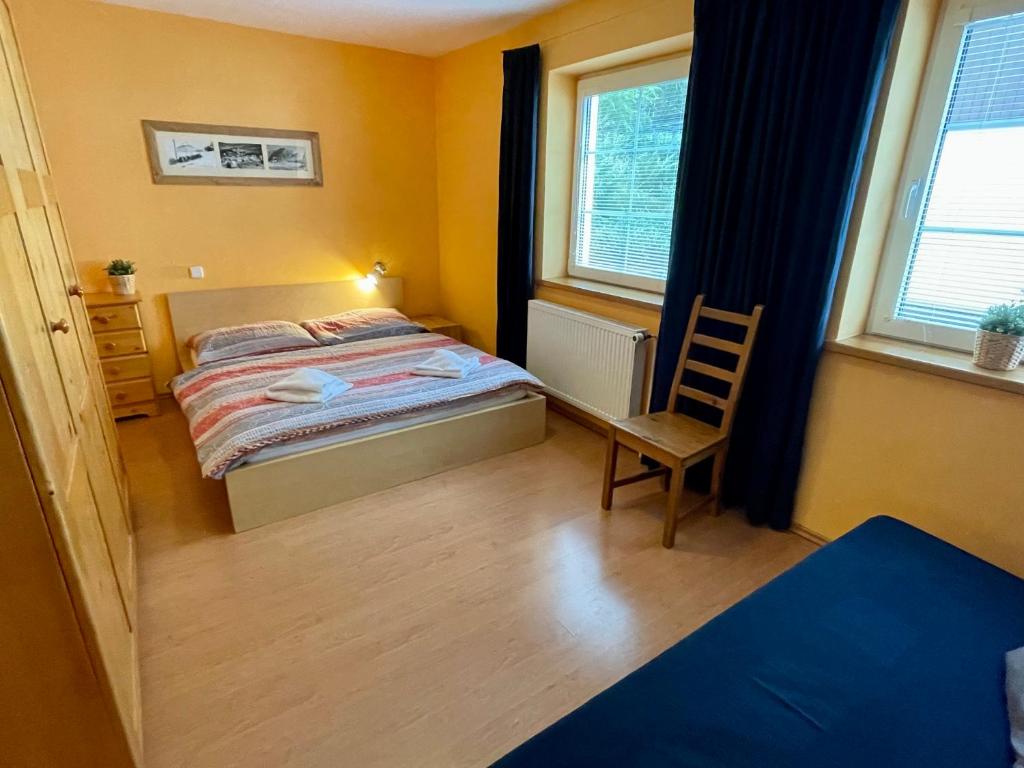 Postel nebo postele na pokoji v ubytování King size apartmán Pension Monika