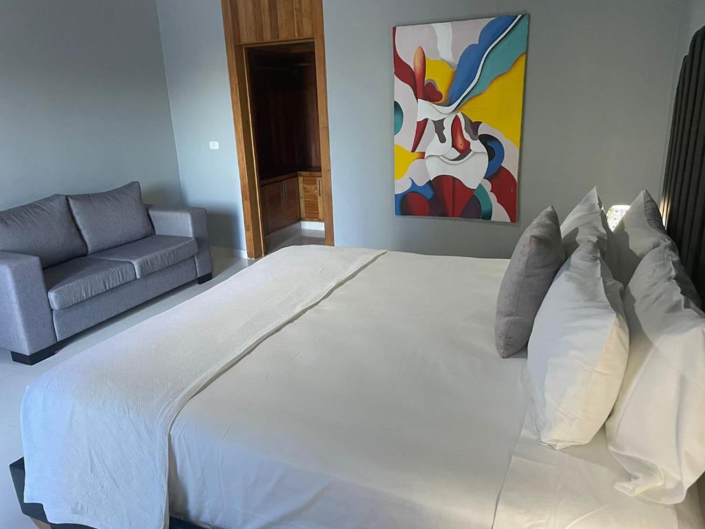 Postel nebo postele na pokoji v ubytování Gaia Residence Deluxe