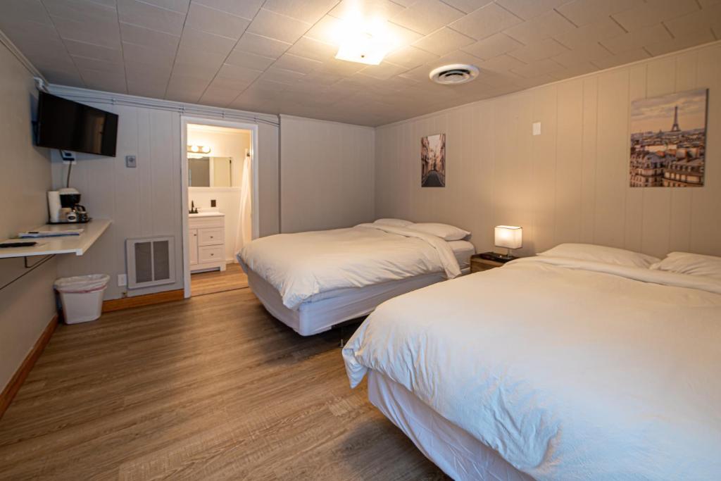 Postel nebo postele na pokoji v ubytování Star Gate Motel