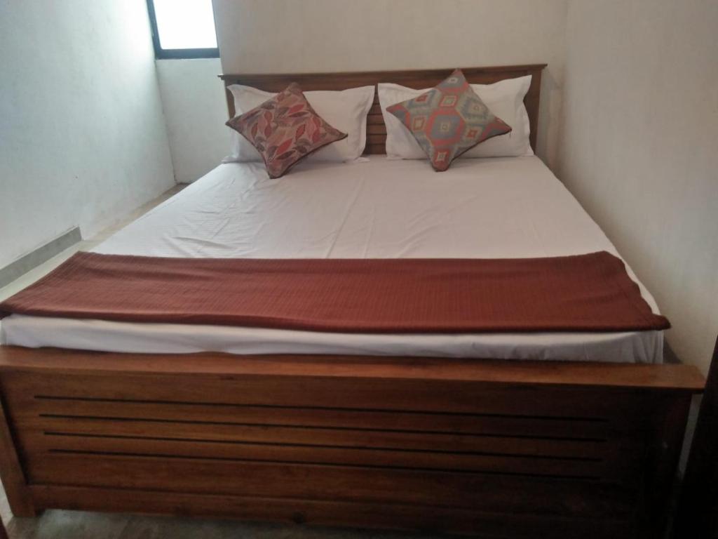 Postel nebo postele na pokoji v ubytování The Jesmine Homestay