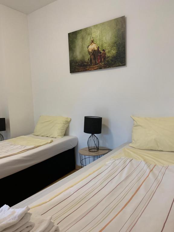 Postel nebo postele na pokoji v ubytování Praktische City Apartments direkt am Hauptbahnhof
