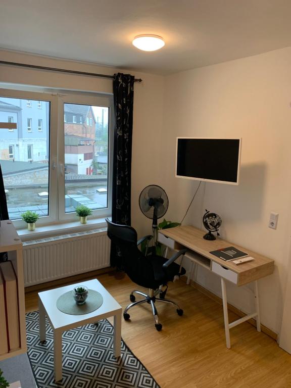 TV a/nebo společenská místnost v ubytování Praktische City Apartments direkt am Hauptbahnhof
