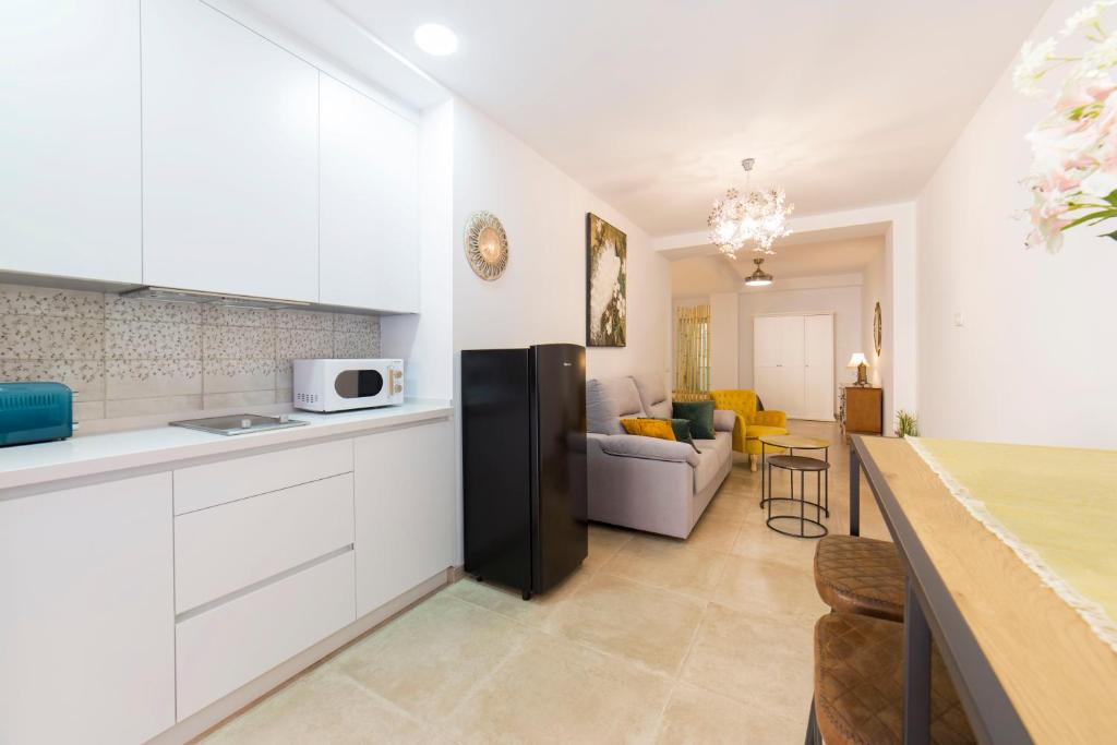 Kuchyňa alebo kuchynka v ubytovaní Precioso Loft El Arcángel II junto a la Ribera