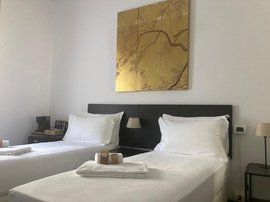 Postel nebo postele na pokoji v ubytování Brignole Rooms