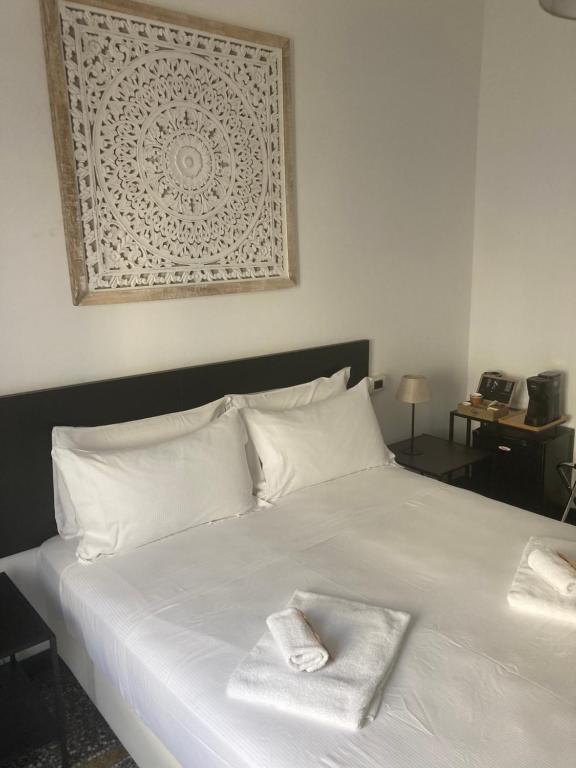Postel nebo postele na pokoji v ubytování Brignole Rooms