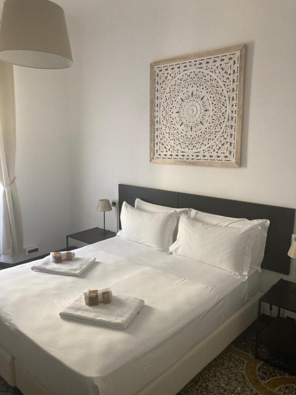 Postel nebo postele na pokoji v ubytování Brignole Rooms