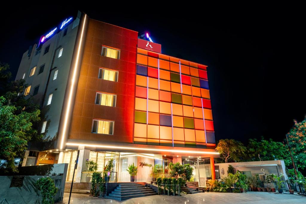 a hotel with a colorful building at night at Inde Signature Jaipur in Jaipur