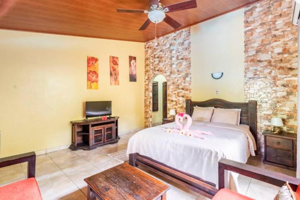 Postel nebo postele na pokoji v ubytování Casa Caribbean Coconut