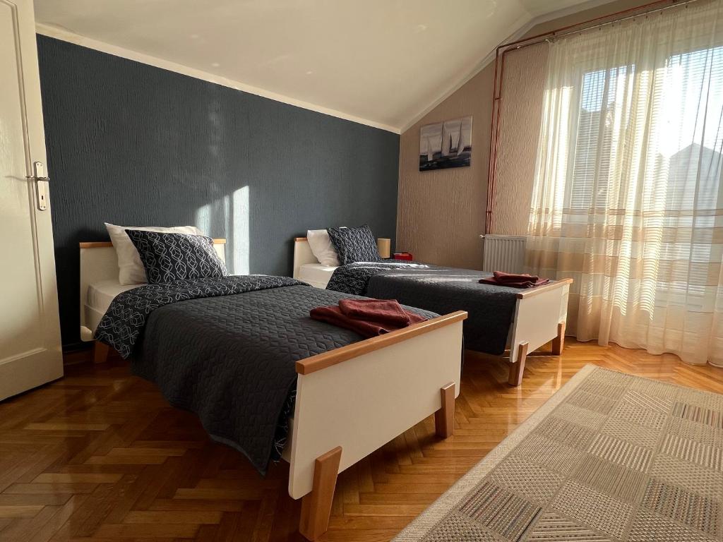 Postel nebo postele na pokoji v ubytování Apartman Stojanović