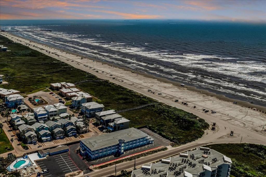 an aerial view of a beach and the ocean at Seaside Boutique Hotel, Waves At Your Doorstep in Port Aransas