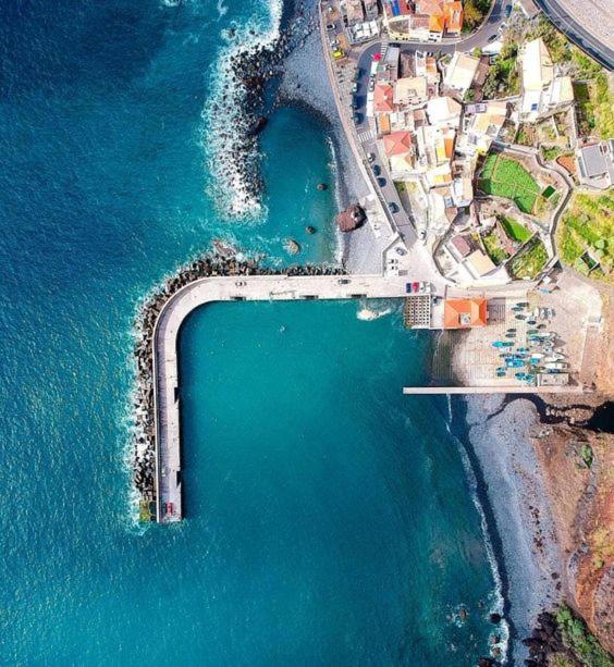 an aerial view of a beach next to the water at Tides proprety - Medium Tide in Paul do Mar
