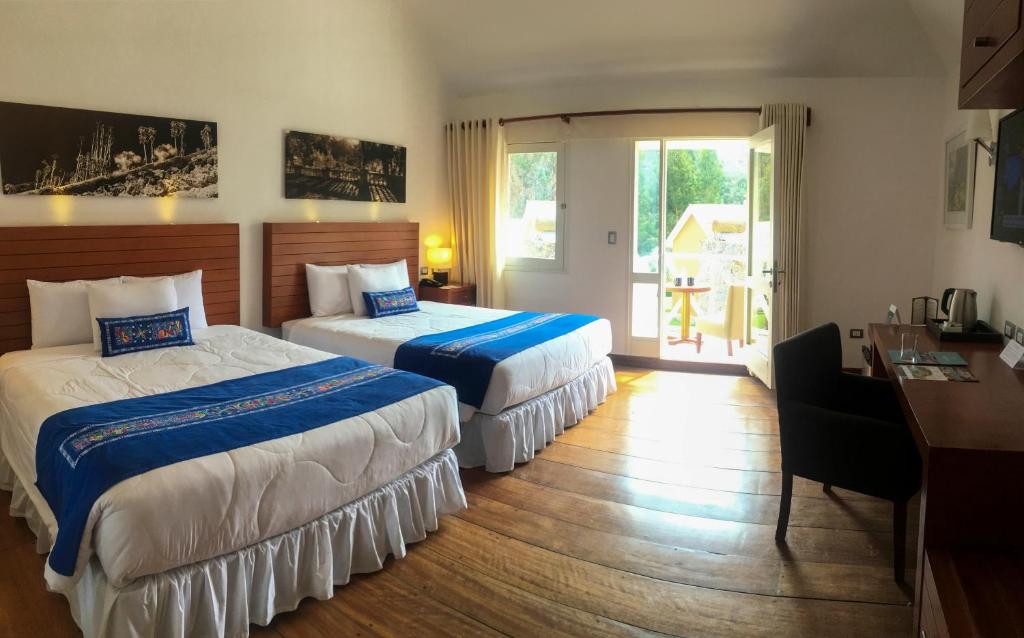 Postel nebo postele na pokoji v ubytování Aranwa Pueblito Encantado del Colca