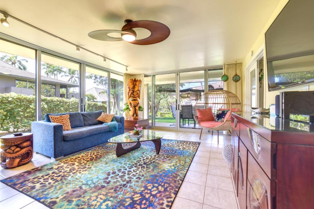 a living room with a couch and a table at Island Oasis Near Kaanapali Beach and Black Rock in Lahaina