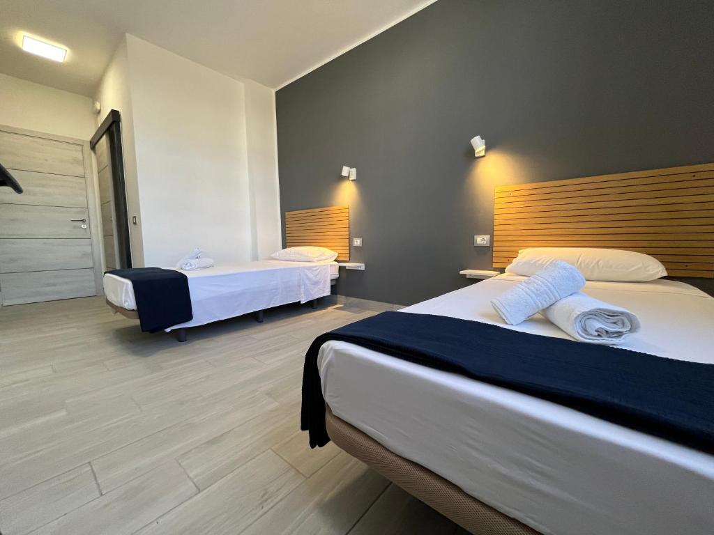 Postel nebo postele na pokoji v ubytování Hotel Pensión Cassandra