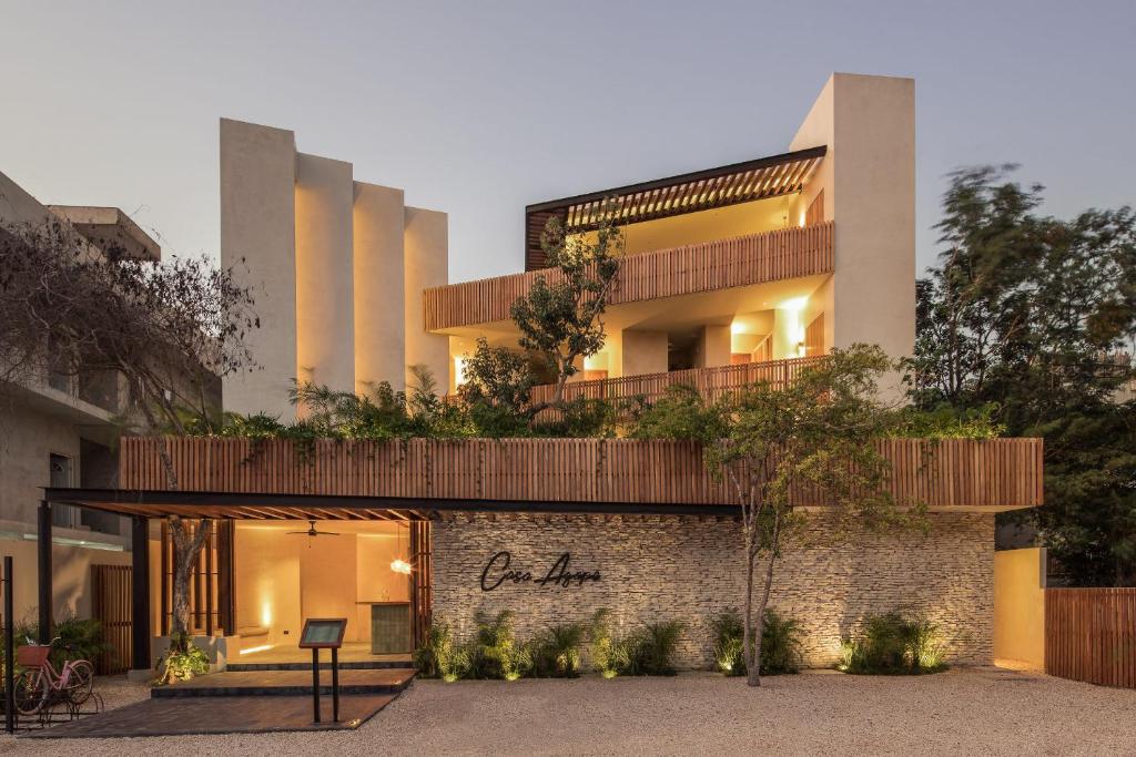 an external view of a building with a facade at Casa Agape Hotel Tulum & Vegan Restaurant with Beach Club Access in Tulum