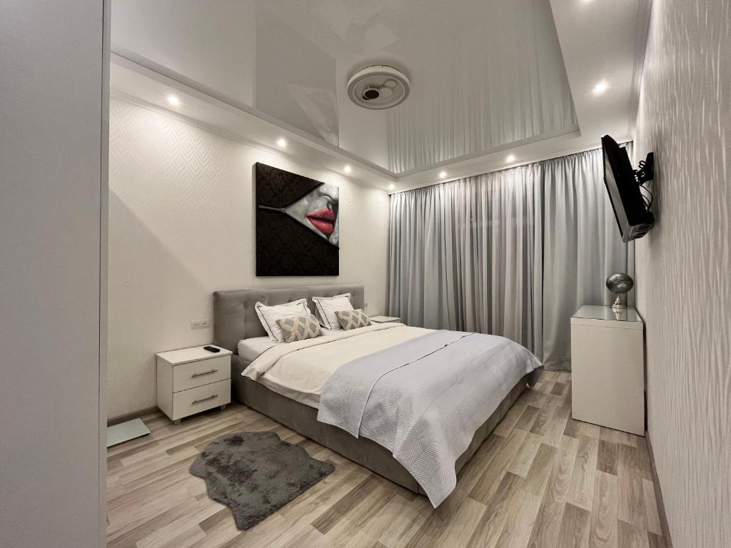 Ένα ή περισσότερα κρεβάτια σε δωμάτιο στο Апартаменти в Arena Apart