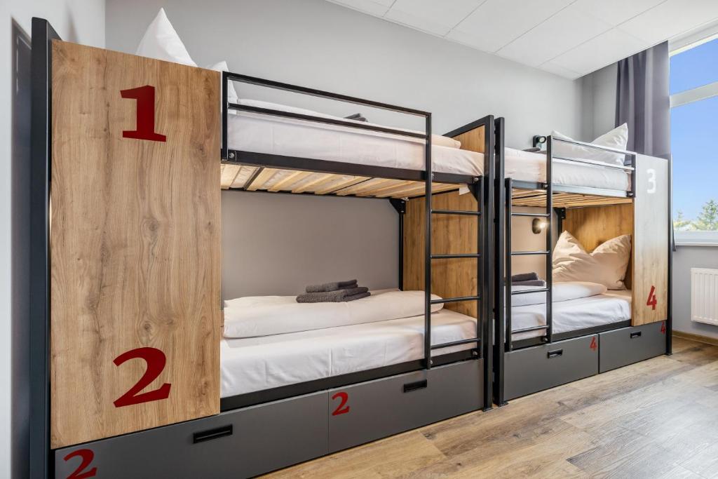 Postel nebo postele na pokoji v ubytování Hostel Am Windberg