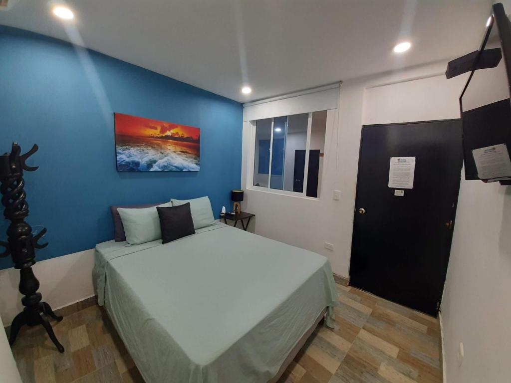 Postel nebo postele na pokoji v ubytování Hotel Sunset Beach