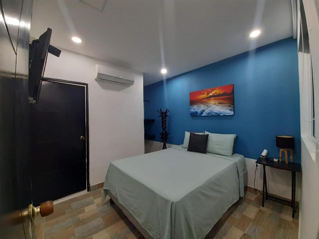 Postel nebo postele na pokoji v ubytování Hotel Sunset Beach