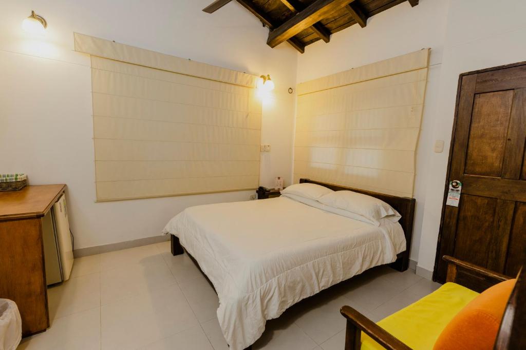 Postel nebo postele na pokoji v ubytování Hotel Rancho Regis