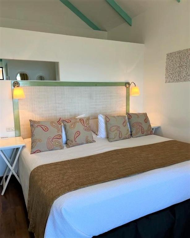Postel nebo postele na pokoji v ubytování Hotel Boutique La Perouse
