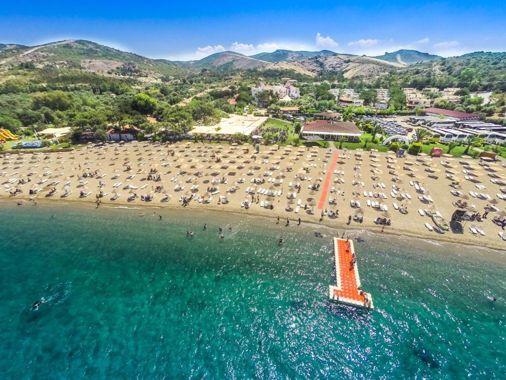 an aerial view of a beach with a pier at Hanedan Beach Hotel in Foça