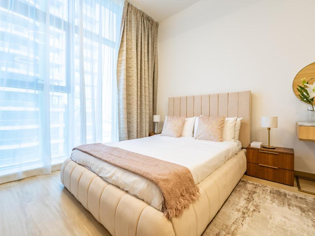 Postel nebo postele na pokoji v ubytování Comfy and stylish Studio in Regina Towers - JVC