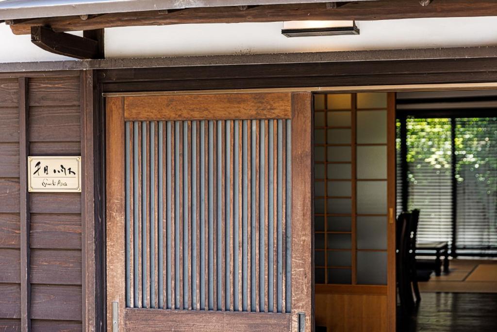 a door to a house with a sign on it at Sennichi House - Vacation STAY 20290v in Kanazawa