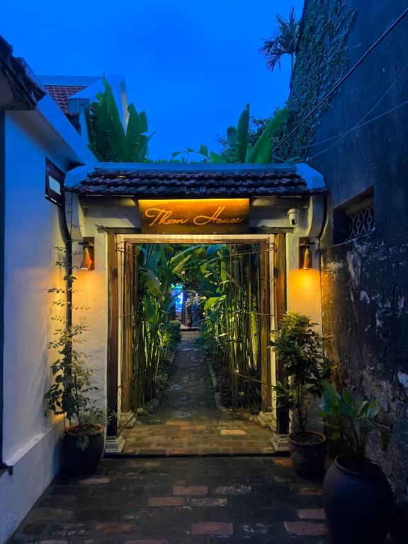 an entrance to a building at night with plants at Tam Coc Thoms House in Ninh Binh