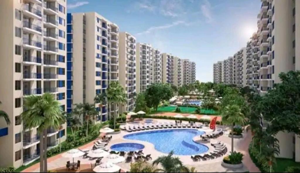 an aerial view of an apartment complex with a swimming pool at Puerto Azul- Club House. in Ricaurte