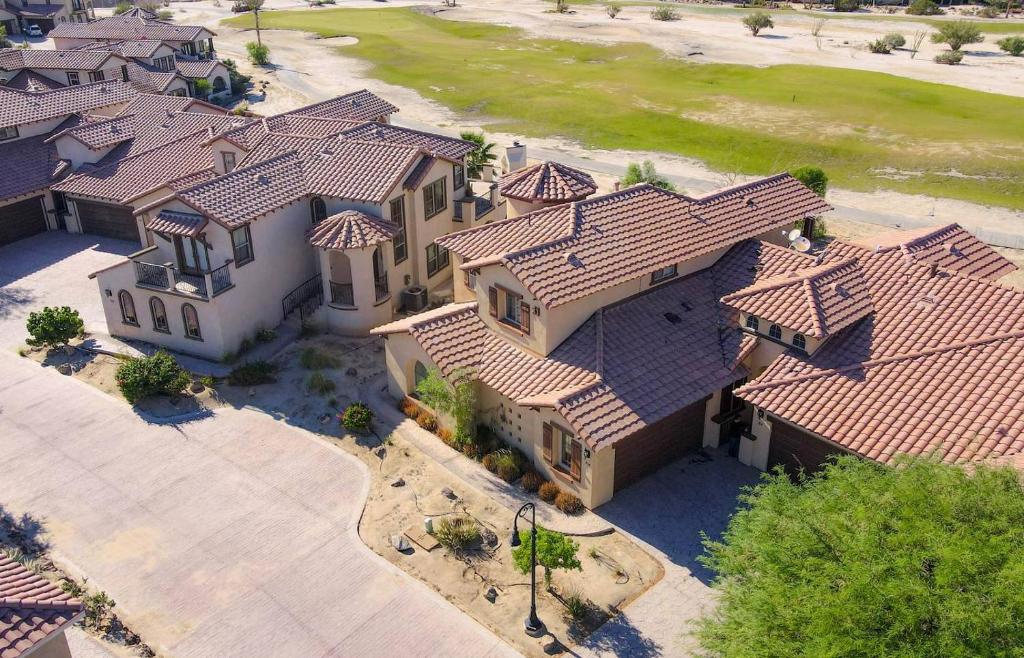 an overhead view of a large house with tiled roofs at Condo 31-1, Right in front of the Pool with WiFi in Playa El Paraíso