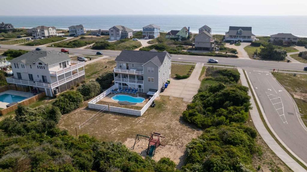 an aerial view of a house with a pool at Southern Paws in Southern Shores