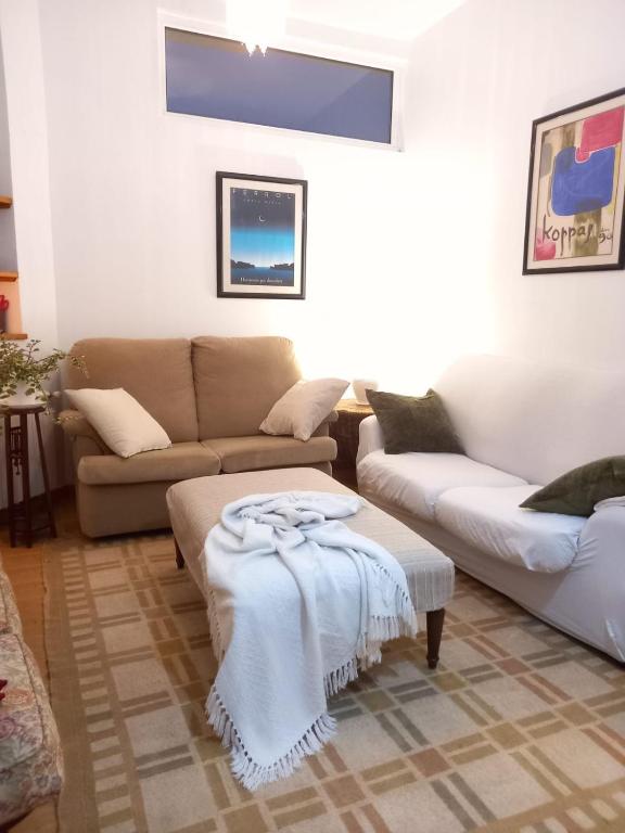 Posezení v ubytování Apartamento con pequeño jardín en el centro