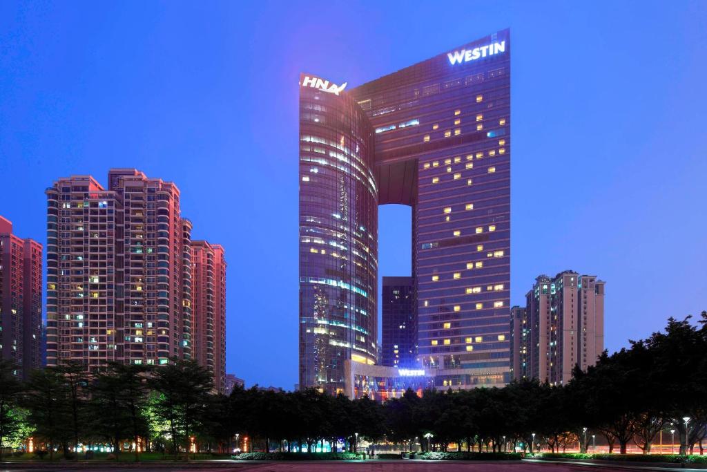 a night view of a building in a city at The Westin Guangzhou in Guangzhou