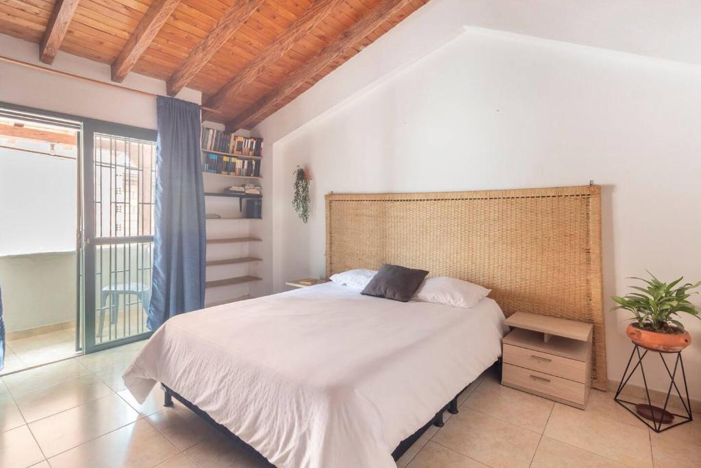 Postel nebo postele na pokoji v ubytování Letto Hostal