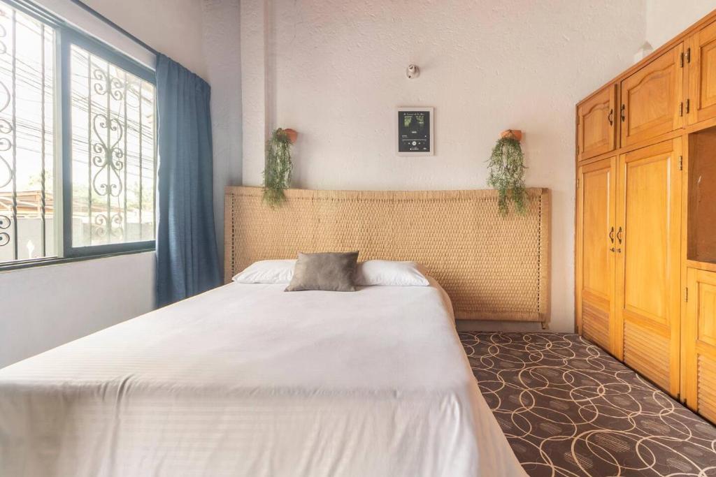 Postel nebo postele na pokoji v ubytování Letto Hostal