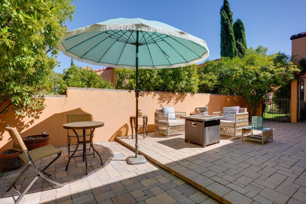 a patio with an umbrella and a table and chairs at Sedona Getaway with Sunlit Patio Near Bell Rock! in Sedona