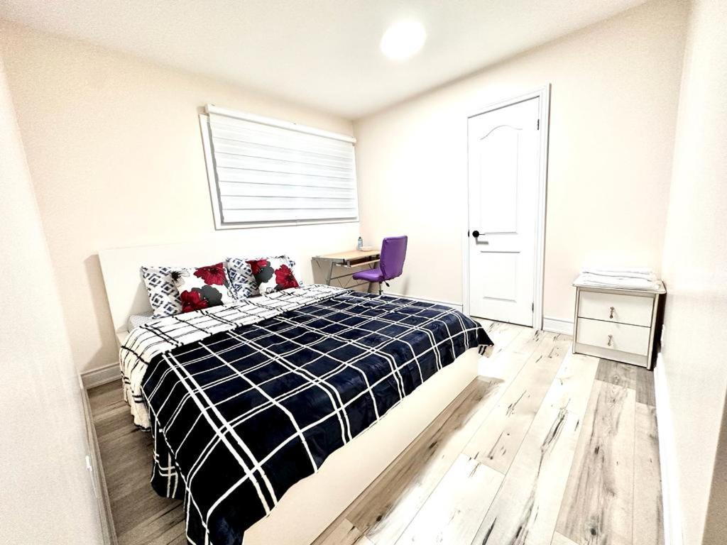 a bedroom with a bed and a desk in it at Master Bedroom with Full Washroom, free wi-fi, free Parking near Fairview Park Mall ROOM 3 in Kitchener