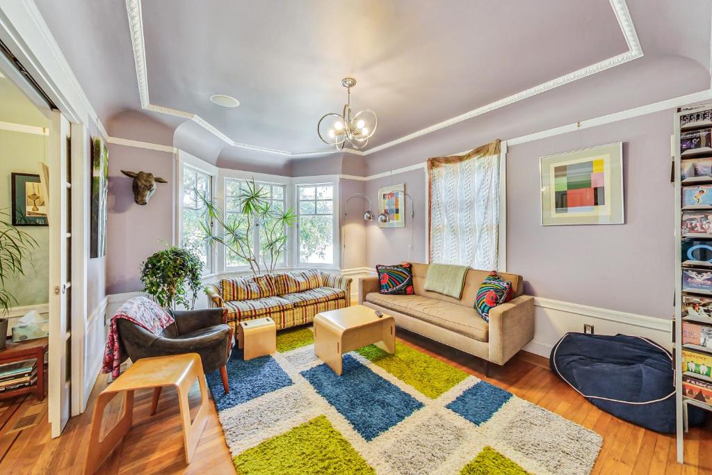 a living room with two couches and a rug at Bernal Heights Spacious 3br Oasis Walk Score 96 in San Francisco