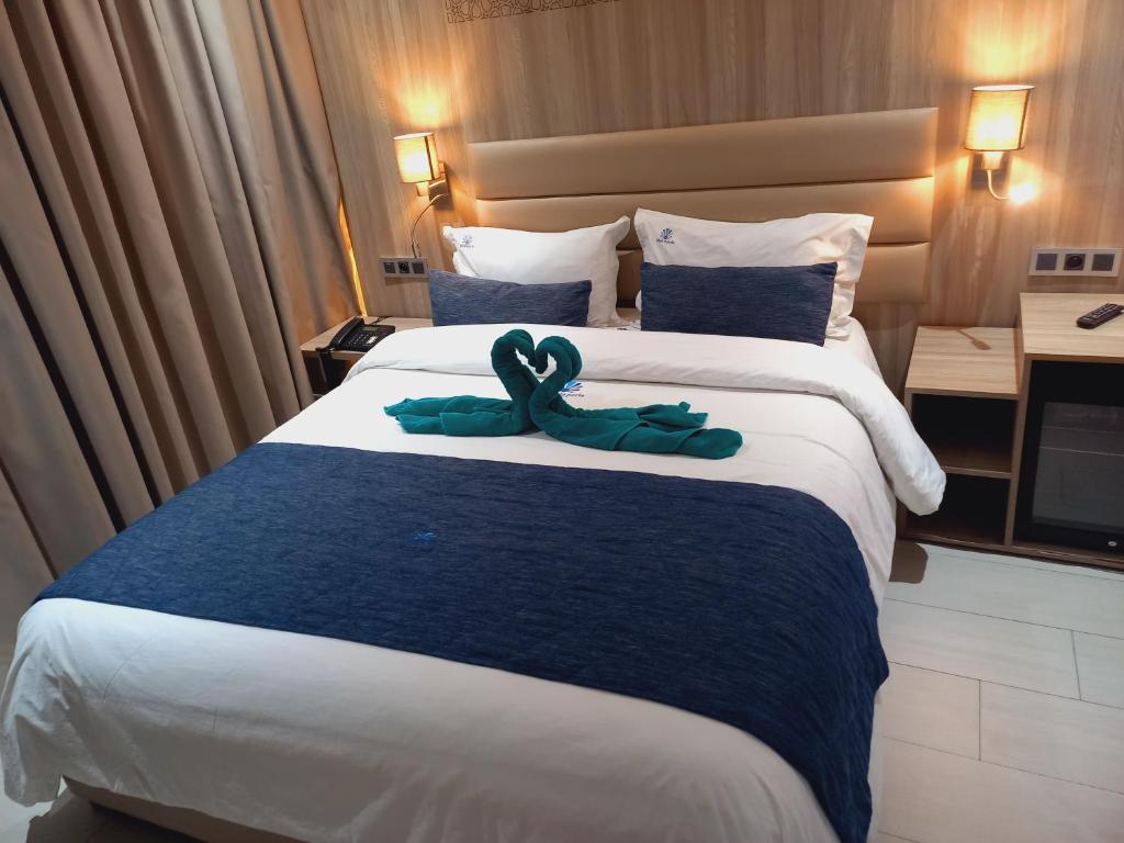 Postel nebo postele na pokoji v ubytování Hôtel La Perla