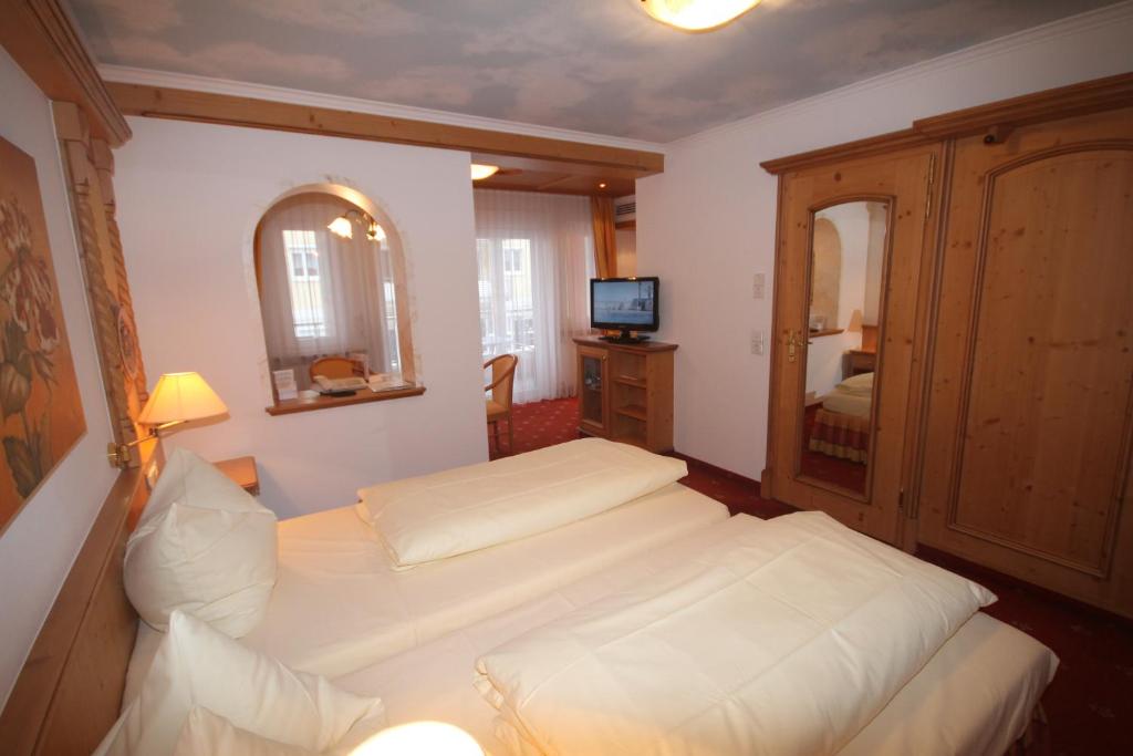 Postel nebo postele na pokoji v ubytování Wohlfühlhotel Bercher