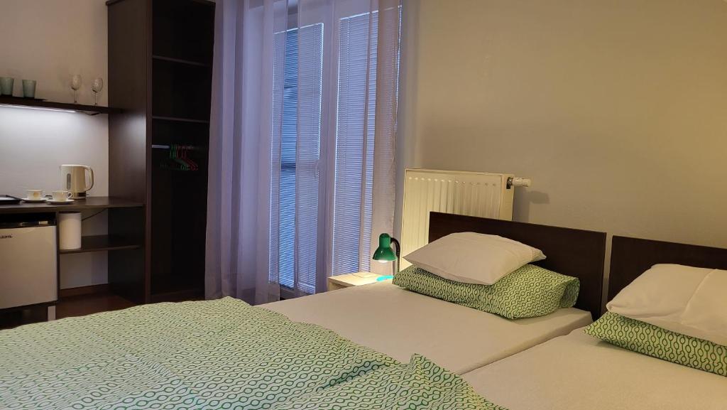 Postel nebo postele na pokoji v ubytování Pokoje Pod 22 Bis