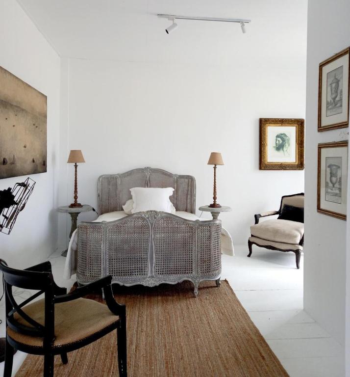 Ένα ή περισσότερα κρεβάτια σε δωμάτιο στο The White House Homestay