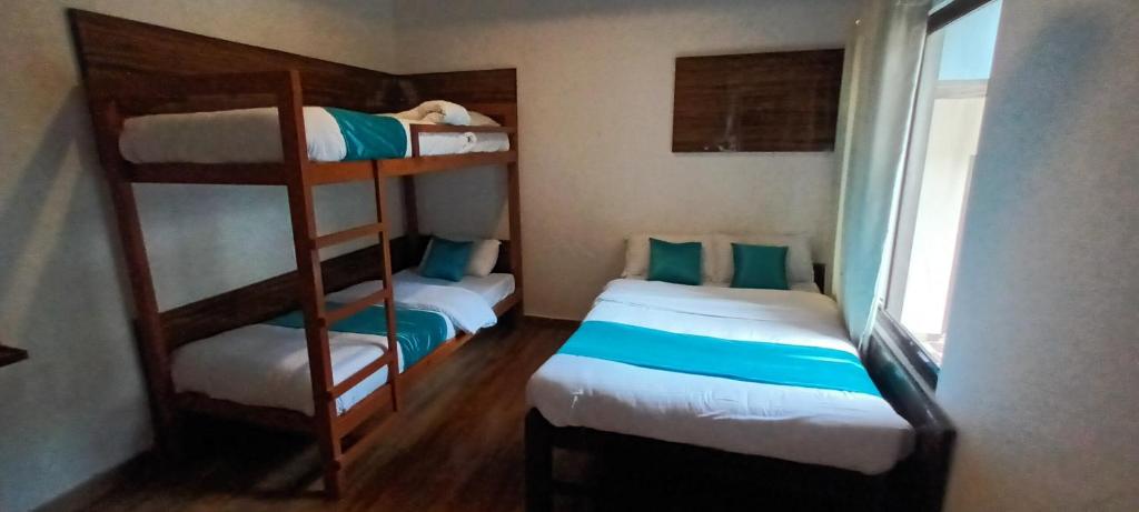Rúm í herbergi á Hotel Dolly